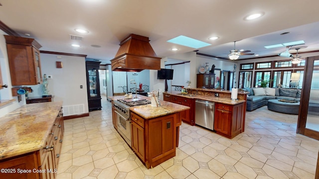 kitchen with visible vents, open floor plan, recessed lighting, a skylight, and stainless steel appliances