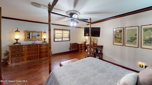 bedroom featuring wood finished floors, baseboards, and ornamental molding