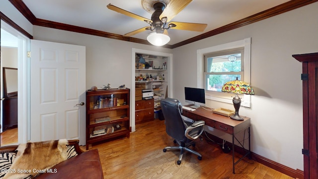 office area featuring light wood-type flooring, baseboards, ceiling fan, and crown molding