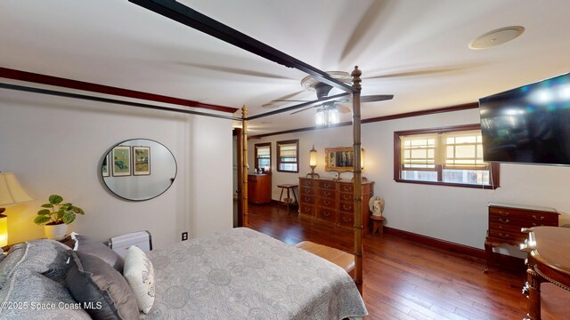 bedroom with hardwood / wood-style flooring, baseboards, and ornamental molding