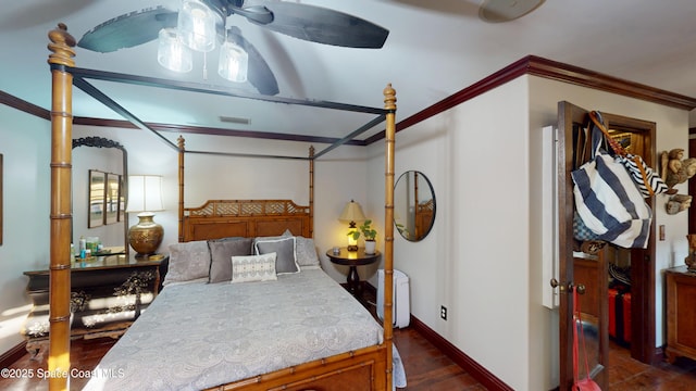 bedroom with baseboards, dark wood-style floors, visible vents, and ornamental molding