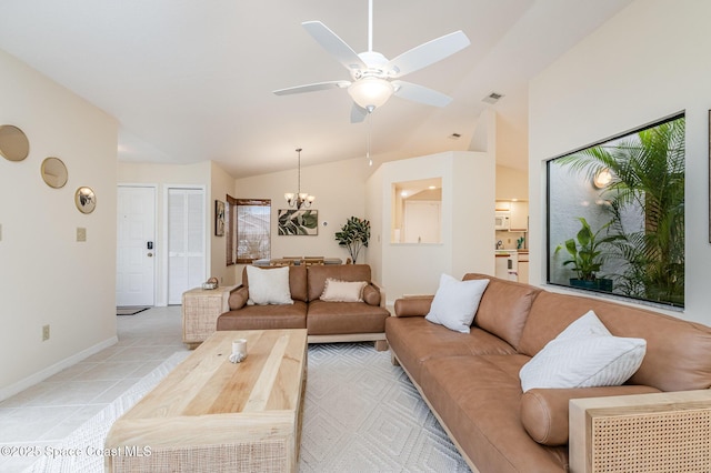 living area featuring visible vents, baseboards, light tile patterned flooring, vaulted ceiling, and ceiling fan with notable chandelier