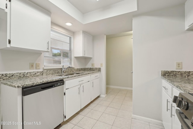 kitchen with a sink, dishwasher, white cabinets, and light tile patterned floors