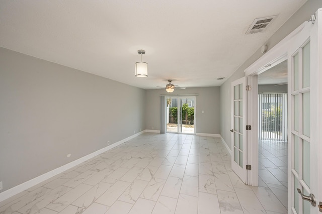 unfurnished room with a ceiling fan, baseboards, visible vents, french doors, and marble finish floor