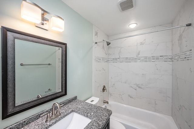 full bathroom featuring visible vents, toilet, vanity, and bathtub / shower combination