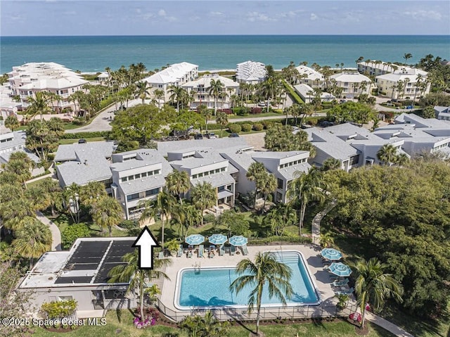 drone / aerial view featuring a residential view and a water view