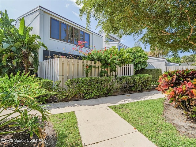 view of front of property featuring fence