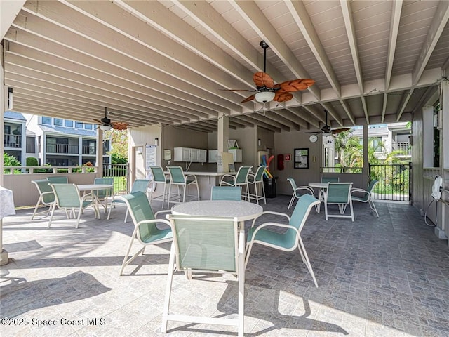 view of patio featuring outdoor dining space and ceiling fan