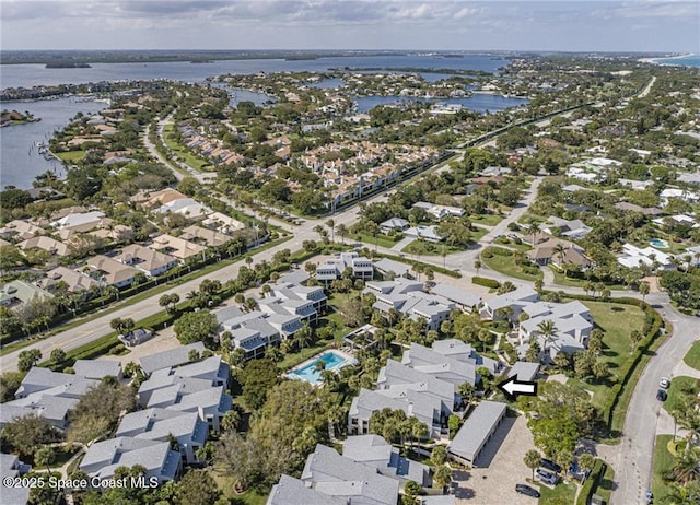 bird's eye view featuring a residential view and a water view