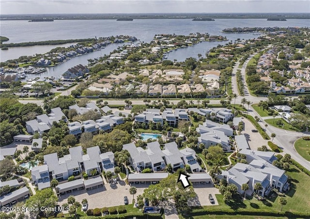 bird's eye view with a residential view and a water view