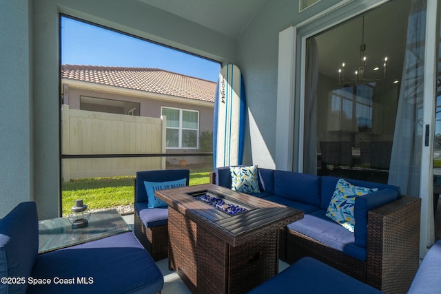 view of patio / terrace featuring an outdoor living space with a fire pit