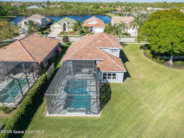 bird's eye view featuring a residential view and a water view