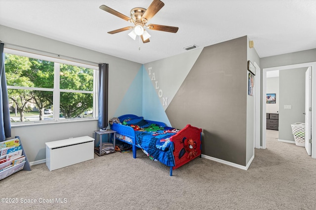 bedroom with a ceiling fan, baseboards, visible vents, and carpet floors