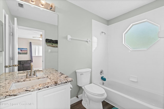 full bath with visible vents, toilet, a healthy amount of sunlight, and  shower combination