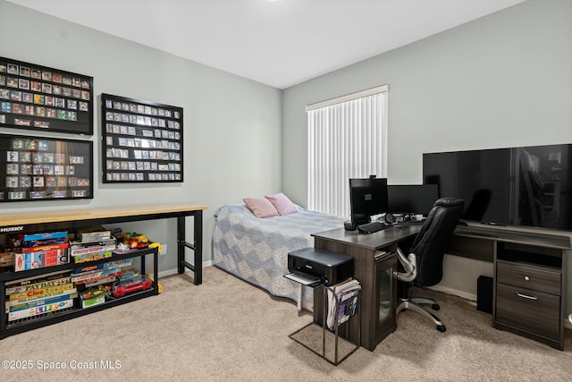 carpeted bedroom with baseboards