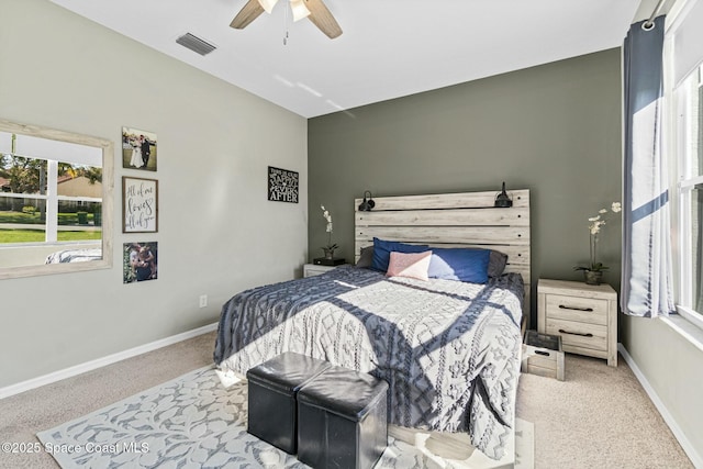 bedroom with visible vents, baseboards, carpet, and ceiling fan