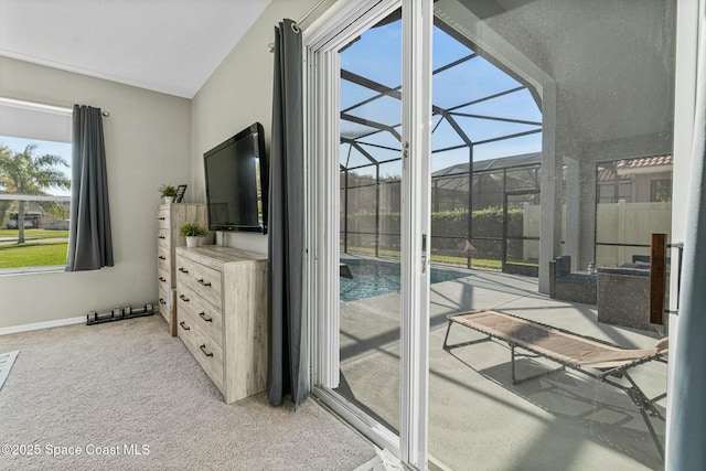 doorway featuring baseboards, light colored carpet, and a sunroom