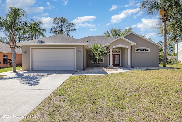 ranch-style home with a shingled roof, concrete driveway, a front yard, stucco siding, and an attached garage