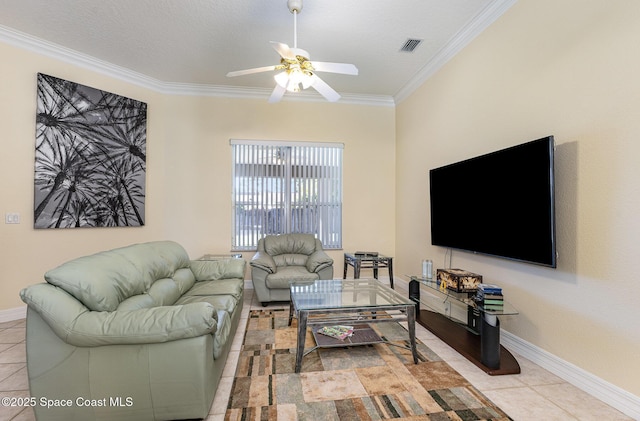 living area with visible vents, baseboards, ornamental molding, and tile patterned flooring