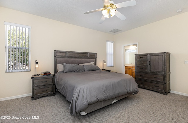 bedroom with light carpet, visible vents, and baseboards