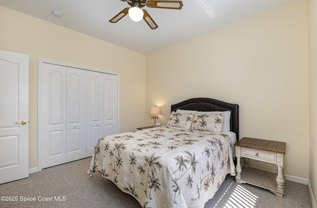 bedroom featuring a closet, baseboards, a ceiling fan, and carpet flooring