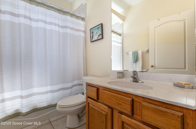 bathroom with vanity, tile patterned floors, and toilet