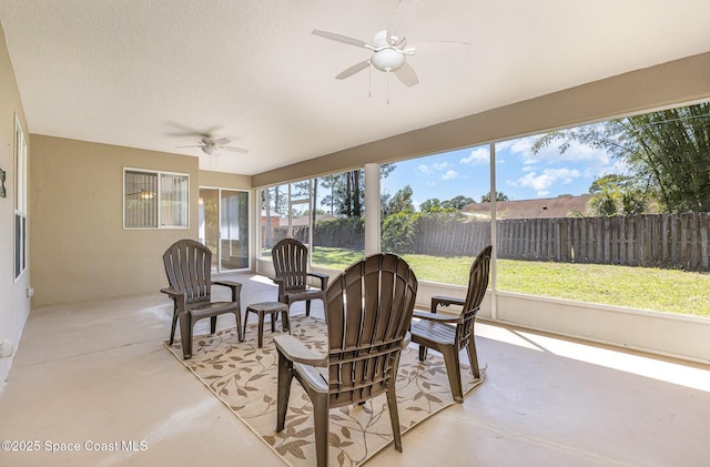 sunroom featuring ceiling fan