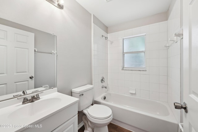 bathroom with toilet, vanity, and shower / bathing tub combination