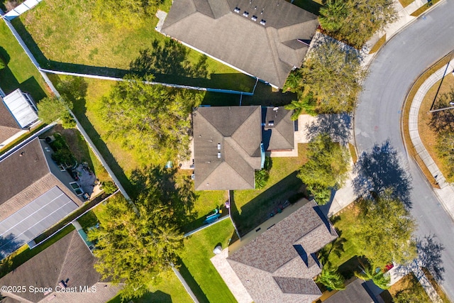 birds eye view of property with a residential view