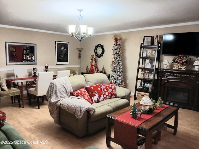 living room featuring an inviting chandelier, a fireplace, and crown molding