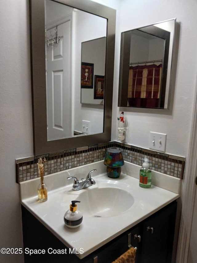 bathroom with decorative backsplash and vanity