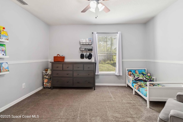 bedroom with carpet flooring, visible vents, baseboards, and ceiling fan