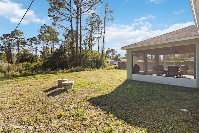 view of yard featuring a sunroom