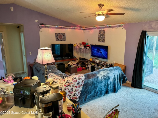 carpeted living room featuring lofted ceiling, a textured ceiling, and a ceiling fan