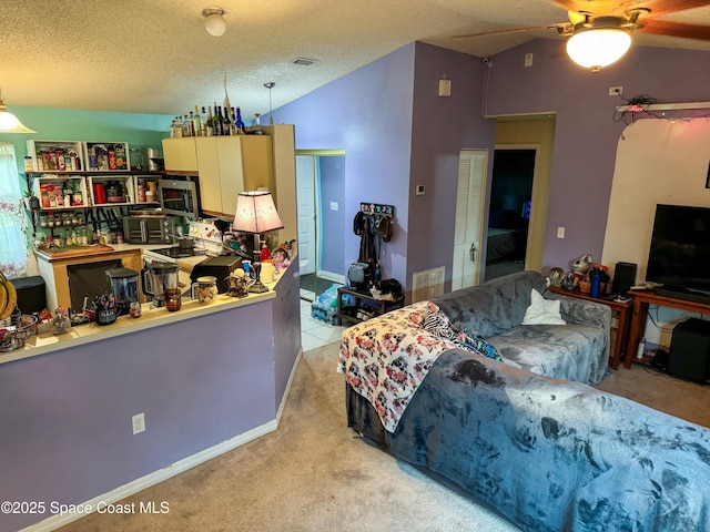 bedroom featuring visible vents, a textured ceiling, a closet, light colored carpet, and vaulted ceiling