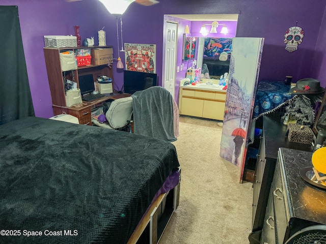 carpeted bedroom featuring a sink