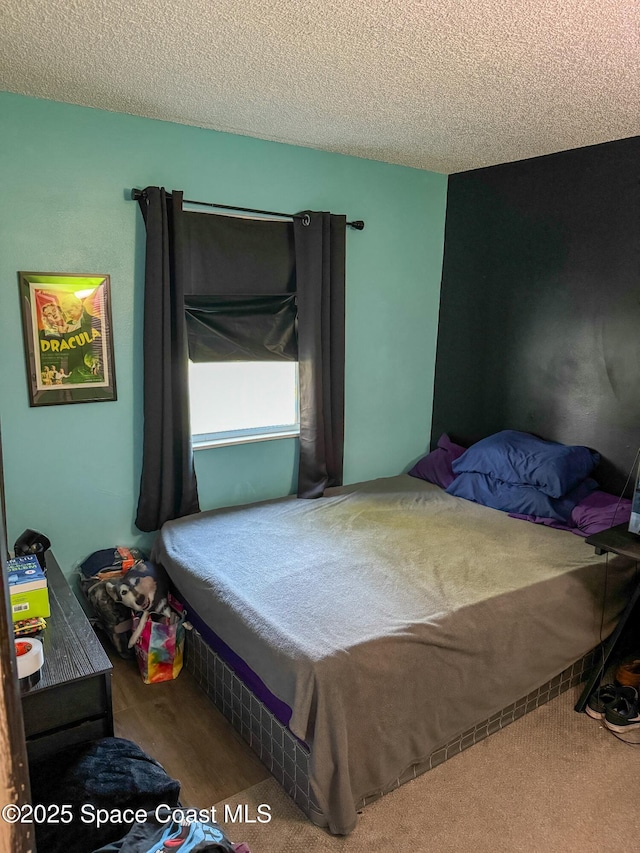 bedroom featuring a textured ceiling