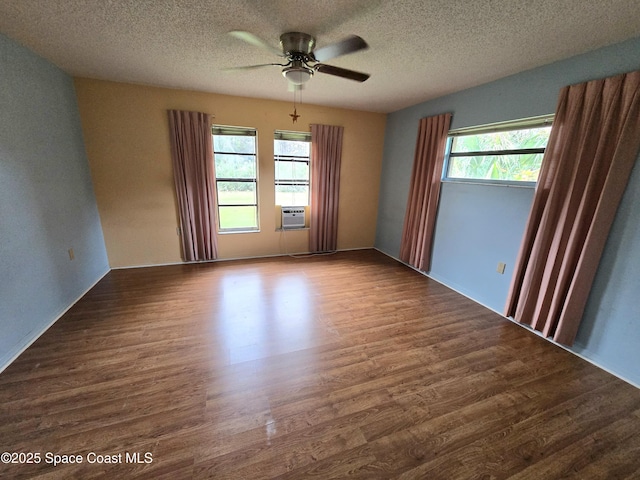 2001 Villa Espana Trl, Melbourne, FL 32935 - empty room with ceiling fan, a textured ceiling, wood finished floors, and a healthy amount of sunlight