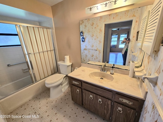2001 Villa Espana Trl, Melbourne, FL 32935 - bathroom featuring bath / shower combo with glass door, toilet, and vanity