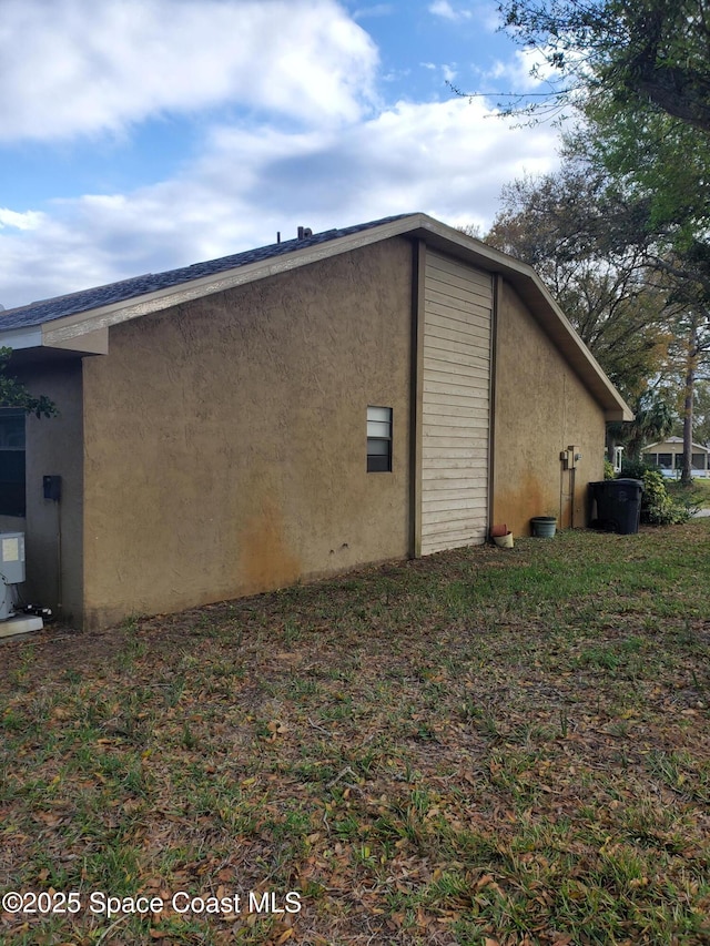 view of side of property with stucco siding