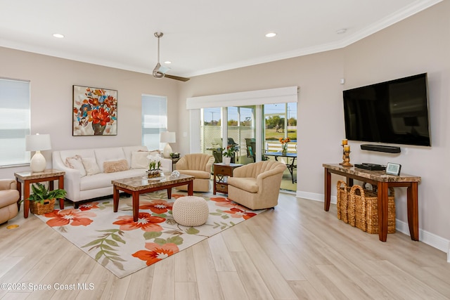 living area featuring recessed lighting, baseboards, light wood-style flooring, and ornamental molding