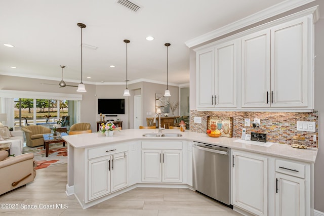 kitchen featuring visible vents, a sink, stainless steel dishwasher, open floor plan, and a peninsula