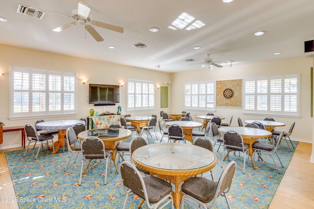 dining area with recessed lighting, wood finished floors, visible vents, and baseboards