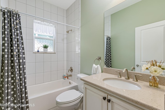 full bath featuring vanity, shower / tub combo, and toilet