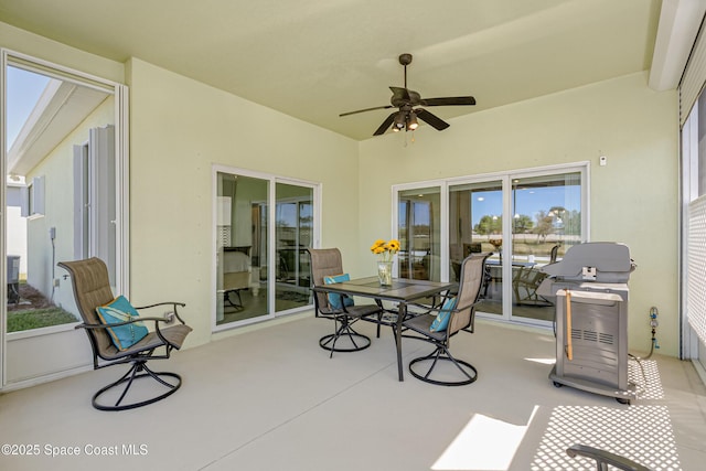 sunroom / solarium with a ceiling fan