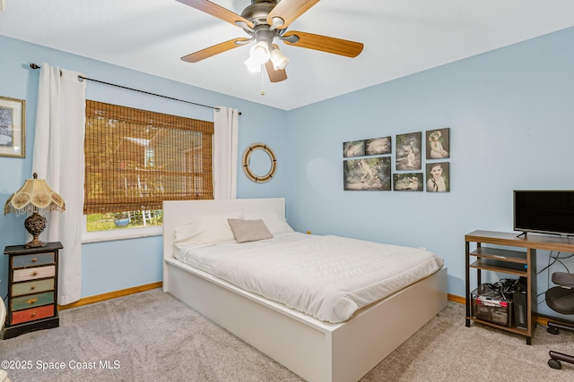 bedroom featuring carpet flooring, a ceiling fan, and baseboards