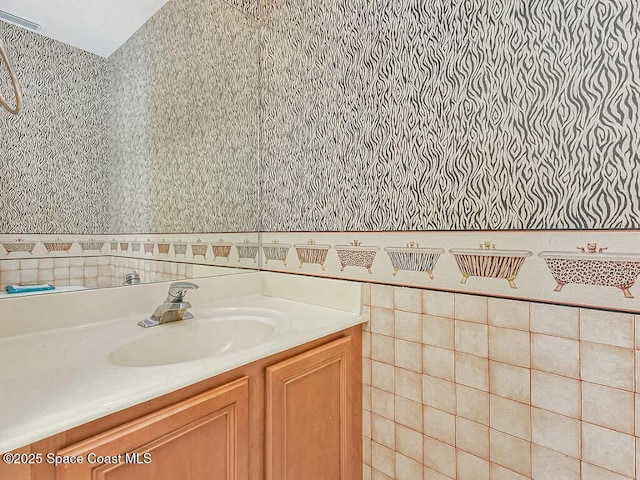 bathroom with vanity and visible vents