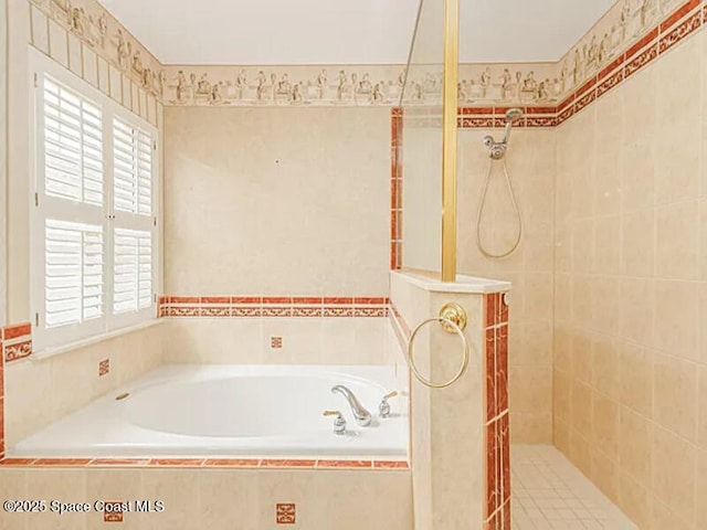 full bath featuring a garden tub and walk in shower