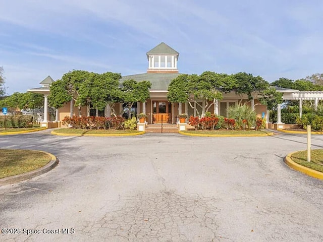 view of front of property featuring uncovered parking