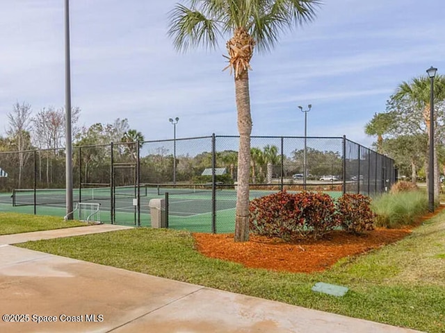 view of tennis court with fence